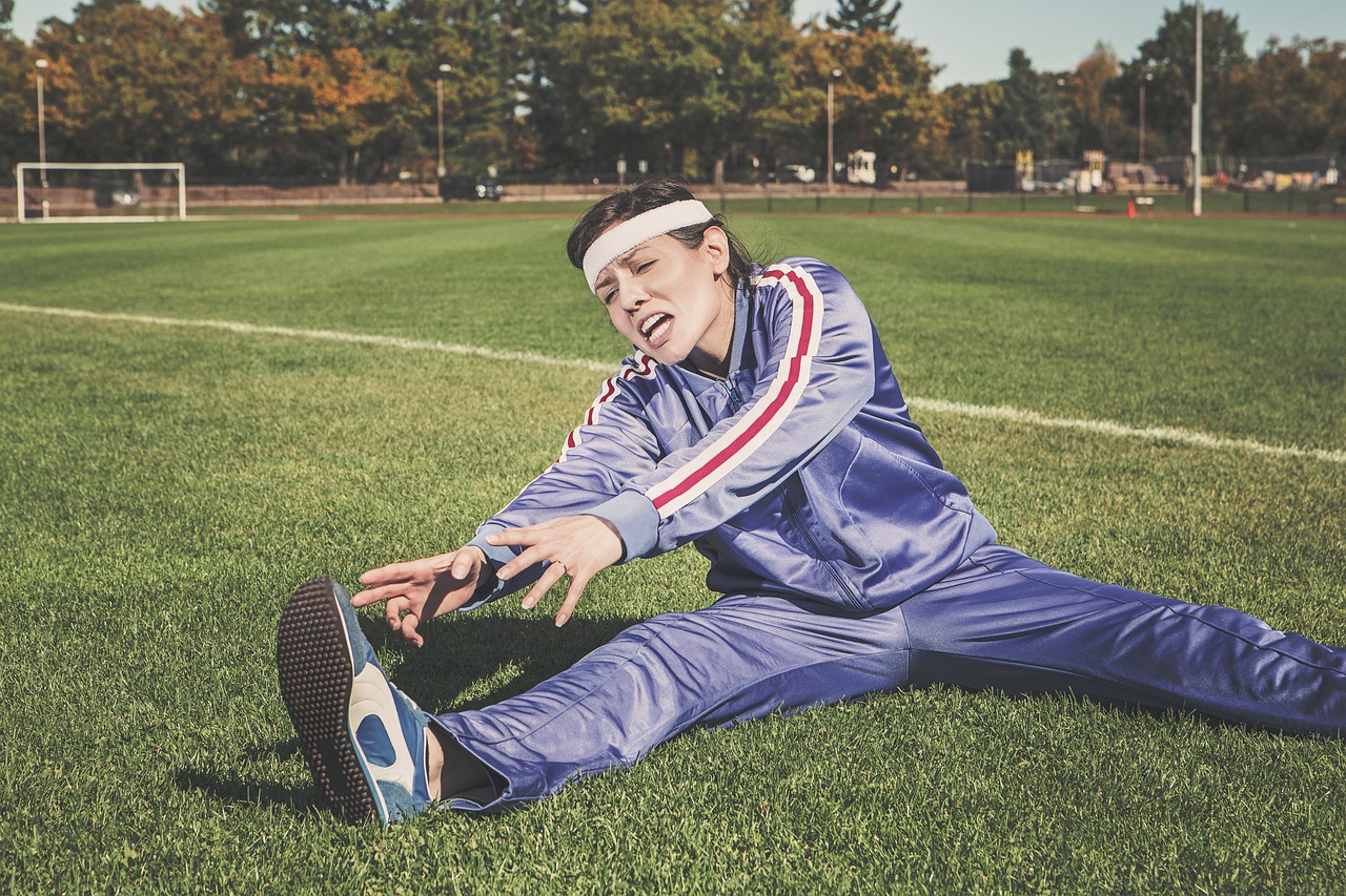 stretching, sports, woman, athlete, fitness, sport, healthy, nature, exercise, workout, young, female, body, lifestyle, training, fit, health, stretch, people, active, girl, adult, person, sportswear, athletic, gym, exercising, physical, sporty, white, pilates, leisure, tracksuit, track and field, shoes, headband, grass, field